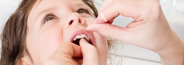 When should a child start flossing?